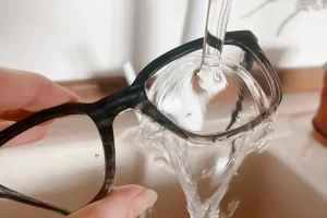 Clean Eyeglasses rinse with water